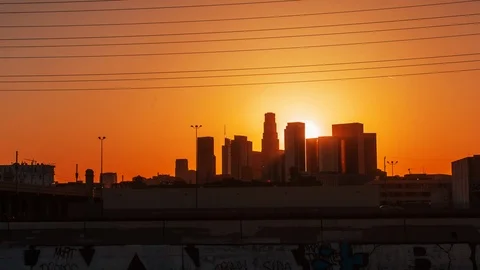 Hyperlapse  of the skyscrapers at sunset with sunshine between buildings Stock Footage 88933971