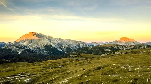 Hyperlapse of sunrise and the moon set on Dolomites Stock Footage 128732931