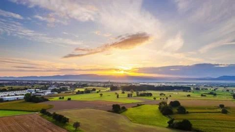 Hyperlapse sunrise with nice dramatic clouds over fields of farm land Stock Footage 250455054