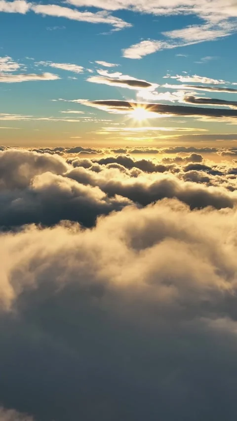 Hyperlapse of sunrise over the clouds. Aerial shot of bright morning sun on blue Video stock 270944460