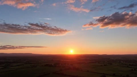 Hyperlapse Sunrise Over Vast Horizon and Cloudy Sky Stock Footage 337398533