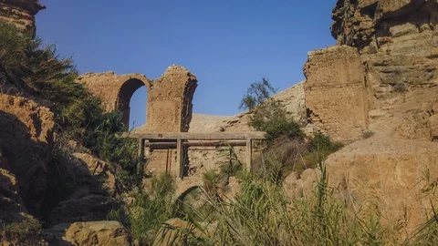 [Hyperlapse] Sunset over ancient aqueduct ruins in Wadi Kelt, Israel, 4k  Video stock 118913656