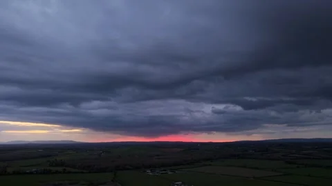 Hyperlapse sunset over fields with dramatic storm clouds 4K Stock-Footage 333933286