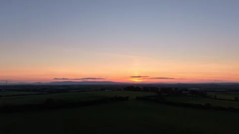 Hyperlapse sunset over rural fields with clear gradient sky Stock-Footage 333933287