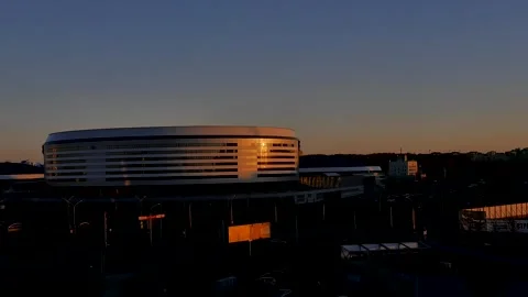 Hyperlapse of the sunset in the reflection of the Minsk Arena building. Stock Footage 221482237