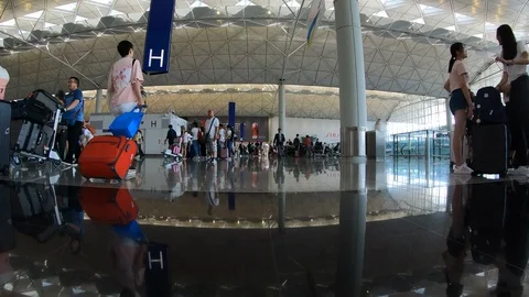 Hyperlapse through busy departure hall Hong Kong international airport Stock Footage 112445896