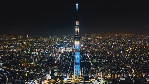 Hyperlapse time-lapse aerial view of Tokyo Skytree and Japan cityscape at night Stock Footage 119532246