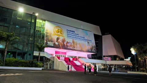 Hyperlapse of Tourists taking pictures at the Red Carpet Palace at night. Stock Footage 247218632