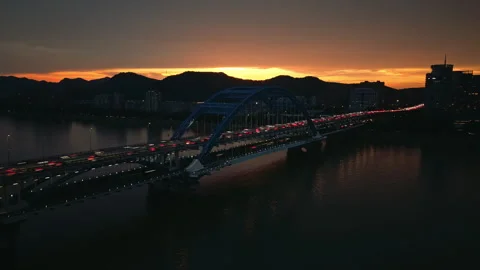Hyperlapse of traffic on the bridge in Hangzhou at sunset with city lights in Stock Footage 340904077