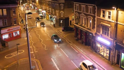 Hyperlapse of traffic moving on road surrounding by houses on night time Stock-Footage 171930637