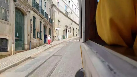 Hyperlapse of tram ride in old town centre in Lisbon, passenger window perspecti Video stock 118659457