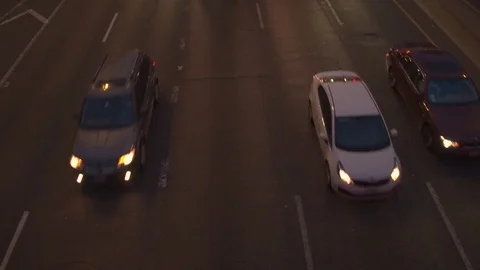 HYPERLAPSE: Vehicles driving along busy multiple lane freeway highway at night Stock Footage 77524944