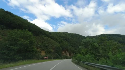 Hyperlapse video of driving on a country road along a valley Stock Footage 294591715