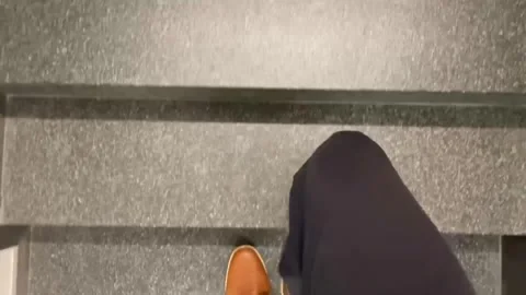 Hyperlapse video of men's feet going up several flights of stairs without Stock Footage 262610287