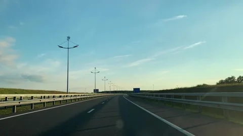 Hyperlapse view from the car. Sunset on the suburban highway Video stock 147076283