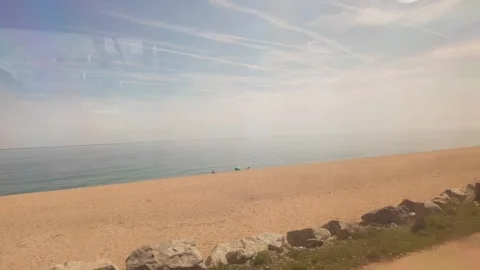 Hyperlapse, View from the window of the train going to Barcelona, coastline trip Stock Footage 276448334