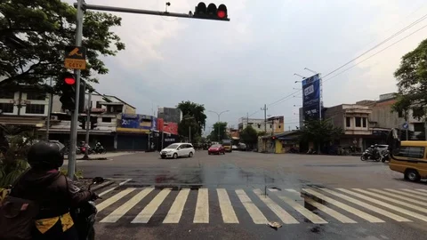 HYPERLAPSE Waiting in the Traffic Light with Busy Road Traffic in The Morning Stock Footage 129362323