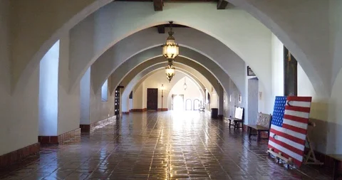 Hyperlapse walking down a long hallway with people and city workers in the Video stock 106869378