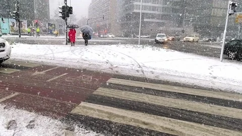 Hyperlapse walking people during snow in urban city center of Ljubljana Stock Footage 153290120
