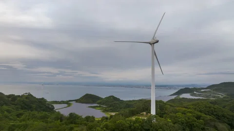 Hyperlapse: Wind turbine stops spinning as clouds move slowly overhead on Stock Footage 208188366
