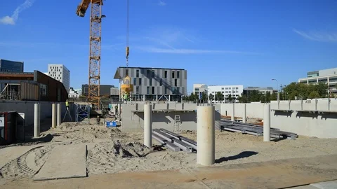 Hyperlapse Workers and Tower Crane in a Building Site with Clouds in NL Stock Footage 95778876