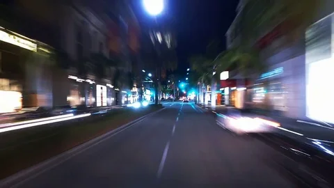 Hyperlapsed view from a car at night. POV. Rodeo Drive and Wilshire avenue. 動画素材 83177205