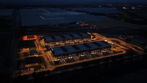 Hyperscale data center aerial view at night for ai and cloud computing Stock Footage 340350004