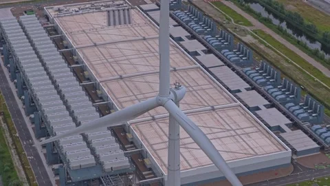 Hyperscale data center campus powered by wind turbine energy Stock Footage 340350868