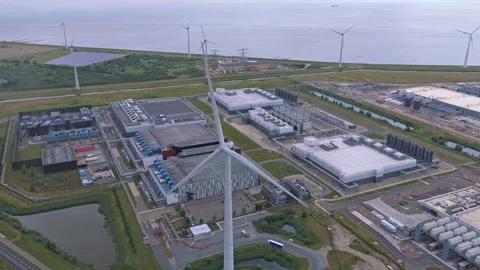 Hyperscale data center campus powered by wind turbines aerial view Stock Footage 340352513