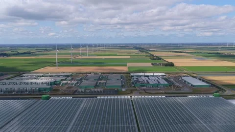 Hyperscale data center with wind turbines in the netherlands countryside Stock Footage 340350447