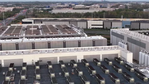 Hyperscale halls stretch across Data Center Alley in Ashburn, Virginia, rooftop Stock Footage 345728498