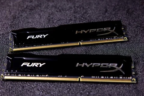 HyperX Fury RAM modules displayed on a dark surface with focus on their design Stock Photos