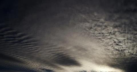 Hypnotic clouds create a classic mackerel sky effect. Stock Photos