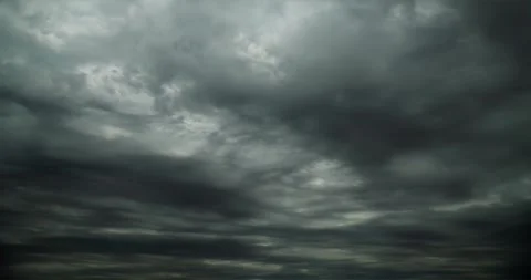 Hypnotic cloudscape darken and storm across the sky like an unsettling dream. 스톡 동영상 296088510