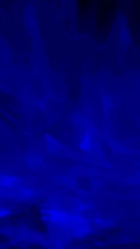 Hypnotic deep blue fluid waves rippling dynamically in mysterious abstract darkn Stock Footage 330946704