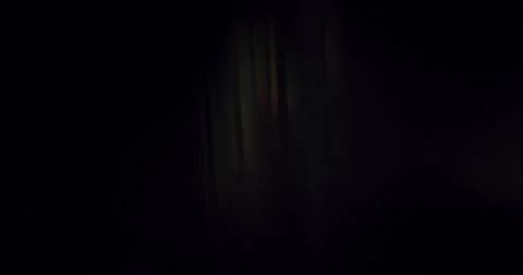 Hypnotic glow of our Spectrum Light Flare Overlay. Against a black background Stock Footage 255863948