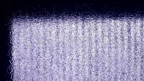 Hypnotic play of the light reflection on rotating clockwise ripple surface Stock Footage 84112098