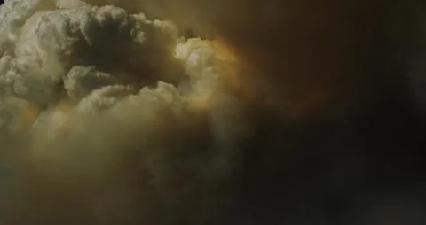 Hypnotic pyrocumulus clouds lend apocalyptic beauty to a dangerous wildfire. Stock Photos