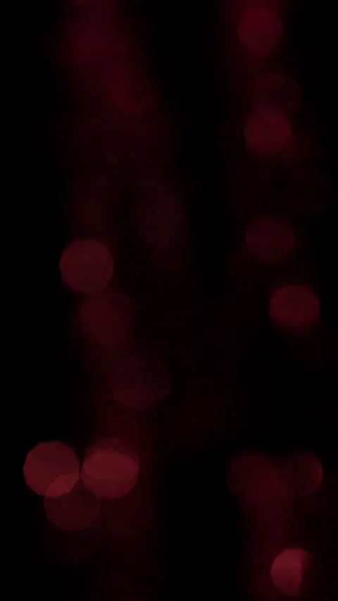Hypnotic Red Bokeh Circles Illuminating Against Black Background Stock Footage 295888356