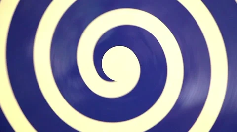 Hypnotic rotating blue spiral on white Video stock 40042079