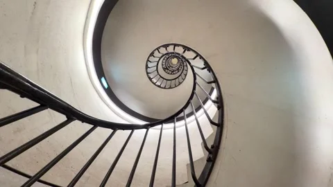 Hypnotic spiral staircase creating an illusion of infinity 스톡 동영상 337532624