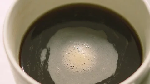Hypnotising Coffee Swirling in Slow Motion in Ceramic White Mug. Stock Footage 337520861