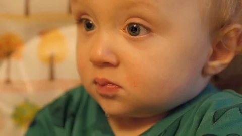 Hypnotized Infant thinking deeply. Reflection. Cute and funny Stock Footage 102564821