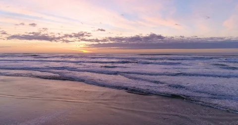 Hypnotizing and Relaxing Ocean Sunset and Waves Crashing at the Tranquil Beach Video stock 123200763