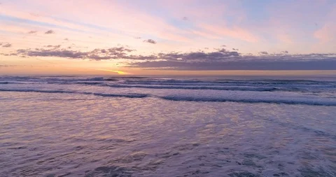 Hypnotizing and Relaxing Ocean Sunset and Waves Crashing at the Tranquil Beach Video stock 123203743