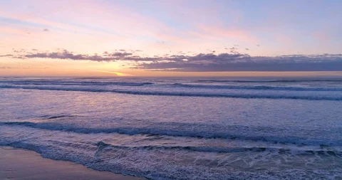 Hypnotizing and Relaxing Ocean Sunset and Waves Crashing at the Tranquil Beach Stock Footage 123204019