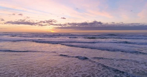 Hypnotizing and Relaxing Ocean Sunset and Waves Crashing at the Tranquil Beach Video stock 123204120