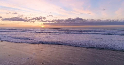Hypnotizing and Relaxing Ocean Sunset and Waves Crashing at the Tranquil Beach Video stock 123204242