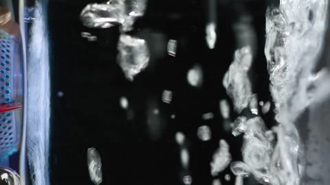 Hypnotizing background Mixed Fluid. Bubbles rising up.  Vertical Footage. Stock Footage 144434246