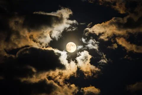 Hypnotizing full moon on dark sky Stock Photos